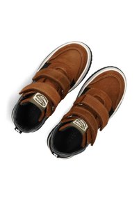 Brown suede sneakers with double Velcro straps, white soles, black accents, and padded black interior lining, viewed from above.