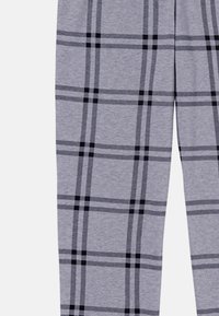 Gray plaid pants made from soft fabric, featuring a black check pattern with contrasting lines, straight leg design, and an elastic waistband.
