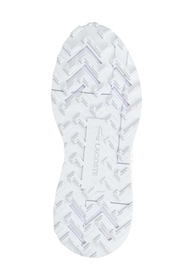 Suola di scarpa bianca con motivo geometrico del battistrada e logo Lacoste in rilievo al centro.