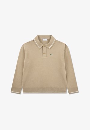 Beige long-sleeve polo shirt made of knitted fabric. Features a classic collar with white stripes, two-button placket, and a green logo.