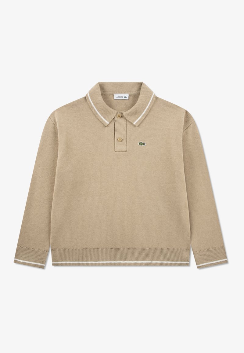 Beige long-sleeve polo shirt made of knitted fabric. Features a classic collar with white stripes, two-button placket, and a green logo.