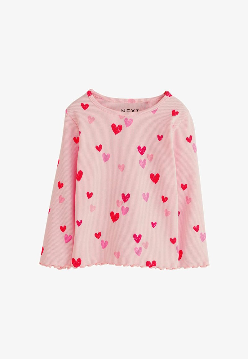 Roza rebrasta majica z razpršenimi srčki v različnih odtenkih roza in rdeče. Oblika z valovitim robom in okroglim ovratnikom.