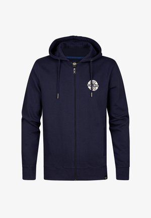 Granatowa bluza z kapturem, zapinana na zamek, wykonana z materiału bawełnianego. Posiada kieszeń kangurką, kaptur ze sznurkiem oraz białą okrągłą logo na piersi.