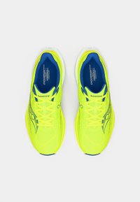 Neon yellow athletic shoes with blue accents, mesh fabric, flat laces, and a streamlined design. Features branding on the side and tongue.