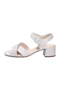 Sandales ouvertes en tissu blanc avec des lanières croisées, boucle de cheville réglable et un talon épais. Texture lisse avec des détails minimaux.