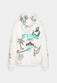 Felpa bianca con cappuccio realizzata in tessuto morbido, caratterizzata da stampe grafiche in nero e teal, tra cui fiamme, teschi e design testuali. Con cappuccio e maniche lunghe.