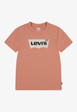 T-shirt rose à manches courtes en coton. Présente un grand graphisme blanc avec le logo "Levi's" en noir. Design ajusté standard avec col rond.