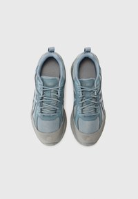 Blue and gray athletic shoes featuring a mesh and synthetic upper, round toe, padded collar, and textured rubber sole.
