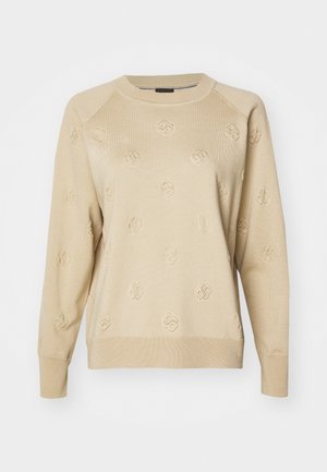 Maglione beige con un motivo tessuto caratterizzato da piccoli loghi in rilievo. Collo a girocollo e polsini a coste, vestibilità comoda e materiale in maglia morbida.