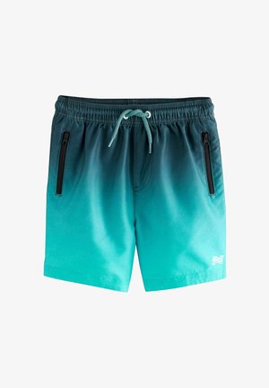 Moške kopalne kratke hlače v teal prehodu z črnim zategovalnikom in zadrgo na stranskih žepih. Narejene so iz lahkega materiala z gladko teksturo.