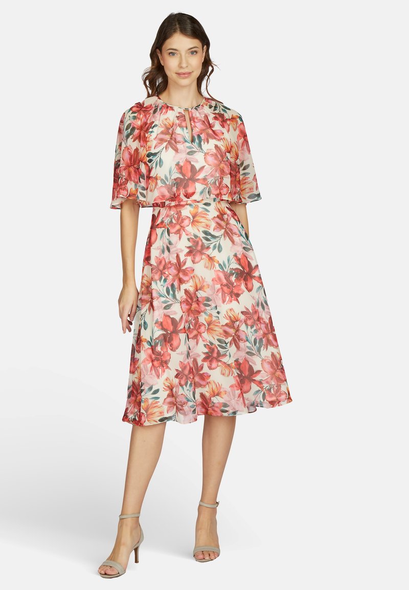 Blumenkleid midi aus leichtem Stoff mit einem rosa und orangefarbenen Blumenmuster, kurzen Ärmeln, Rundhalsausschnitt und A-Linie Silhouette.