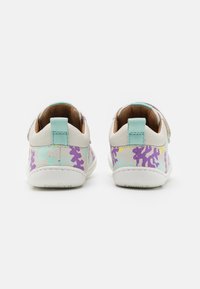 White and pastel sneakers with purple, blue, and yellow abstract patterns. Smooth leather with a textured back and light blue heel tab.