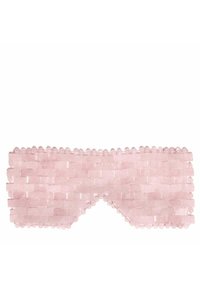 Różowa maska do spania wykonana z tkanej tkaniny o teksturowanym wzorze, z zaokrąglonymi krawędziami i koralikowymi ozdobami wzdłuż górnej krawędzi.