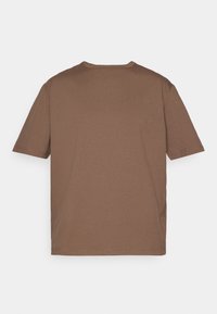 Brown short-sleeve t-shirt made of soft fabric. Rounded neckline, straight cut, and minimal detailing, with no visible logos or patterns.