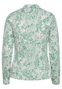 Veste blanche à manches longues avec imprimé floral vert, une couture au dos et un petit col, vue de dos.