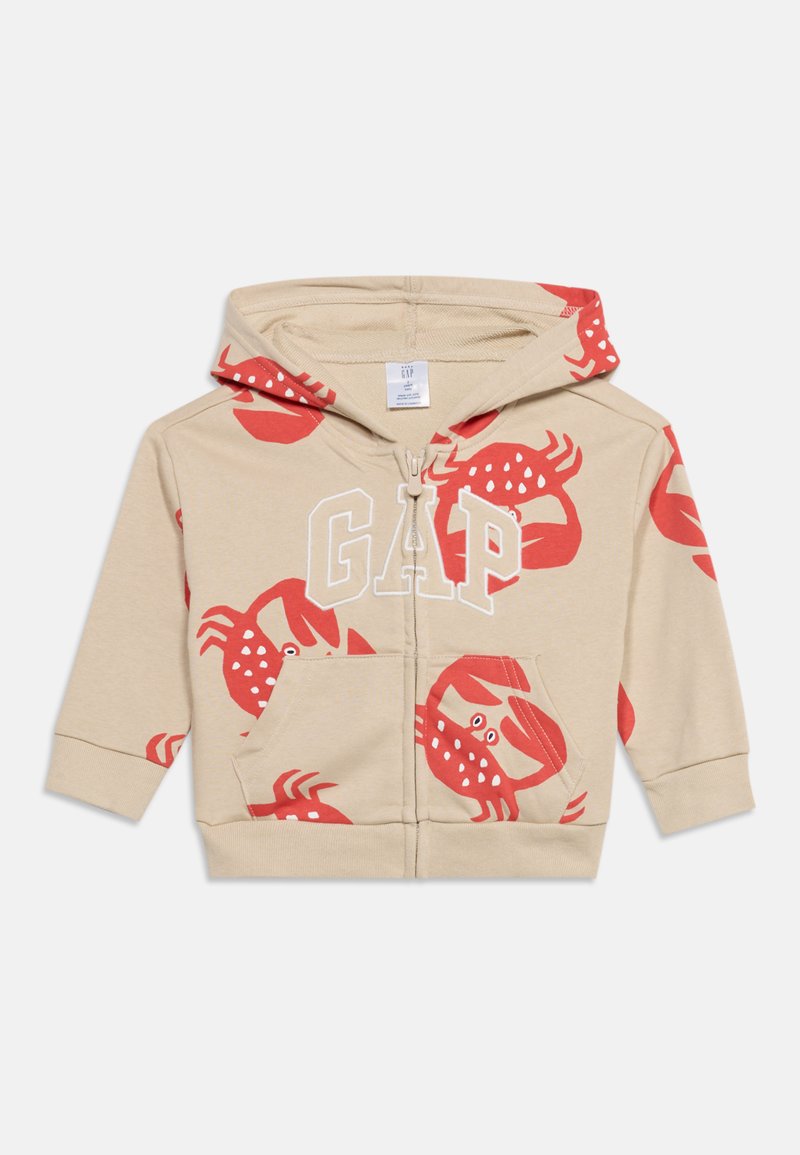 Sweat à capuche beige pour tout-petit avec imprimés rouges de crabes, fermeture éclair frontale, poches kangourou et logo blanc "GAP" sur la poitrine.