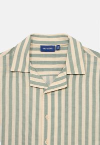 Short-sleeve shirt with vertical green and beige stripes, buttoned front, and a collar, label showing brand and size inside neckline.