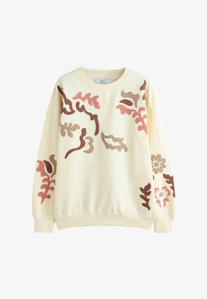 Kreminės spalvos džemperis su rožinės, rudos ir smėlio spalvos abstrakčių lapų ir gėlių aplikacijų raštais priekyje ir rankovėse.