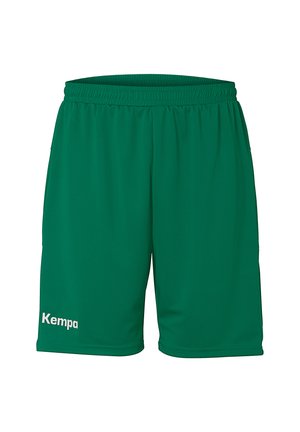 Green athletic shorts made of smooth, lightweight fabric with an elastic waistband. Features a small white “Kempa” logo on the left leg.
