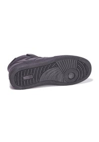 Zwarte sport schoenzool van textuurrubber, met groeven, profielen en een cirkelvormig designelement nabij het midden.