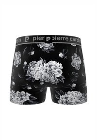Boxer noir avec un grand motif floral de pivoine blanche. Taille élastique avec la marque "Pierre Cardin". Matière douce.