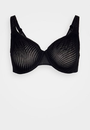Reggiseno in pizzo nero con un design trasparente a texture, supporto con ferretto, spalline regolabili e fascia liscia.