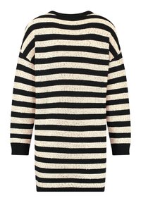 Zwart en beige gestreepte oversized trui, gebreide textuur, geribbelde manchetten en hals. Heeft horizontale strepen van verschillende breedten.