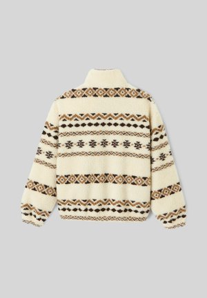 Pull en polaire avec un col montant, de couleur crème, orné de bandes à motifs marron et noir sur le dos. Surface texturée.