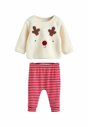 Cremiges flauschiges Langarmshirt mit Rentiergesicht und roter Nase, kombiniert mit rot-weiß gestreiften Leggings für Kleinkinder.