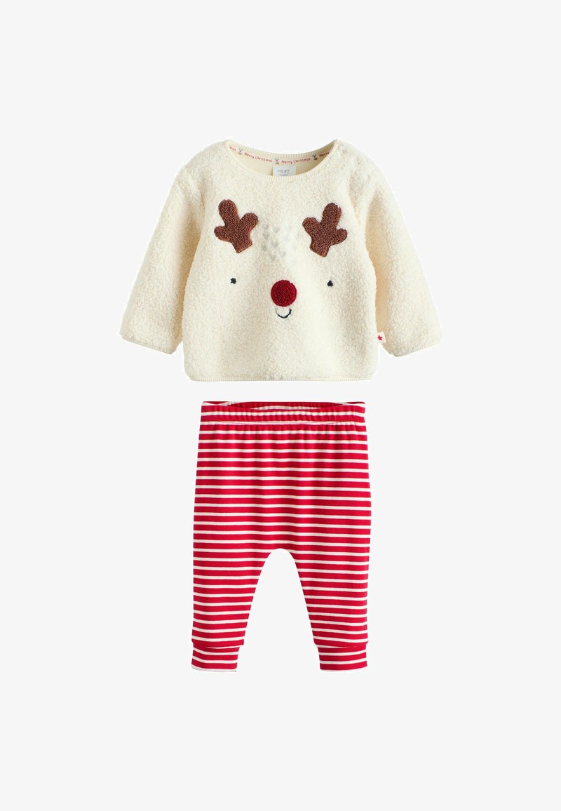 Haut long à manches longues crème pelucheux avec visage de renne et nez rouge, associé à des leggings rayés rouges et blancs pour enfants en bas âge.