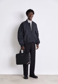 Tommy Hilfiger CENTRAL SLIM COMPUTER BAG UNISEX - Geantă laptop - black