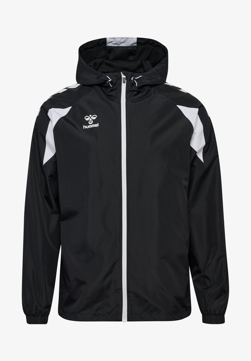 Giacca sportiva con cappuccio bianco e nero, con cerniera frontale, polsini elastici e logo Hummel sul petto.