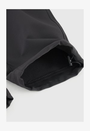 Zwarte stoffen mouw met elastische manchet, met een gladde textuur en subtiele glans. Verstelbaar trekkoord bij de opening voor een goede pasvorm.