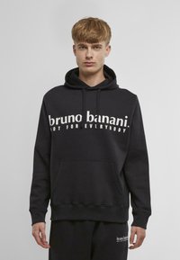 Sudă neagră dintr-un amestec de bumbac, cu un buzunar tip kangaroo, având text alb "bruno banani. NOT FOR EVERYBODY" pe piept.
