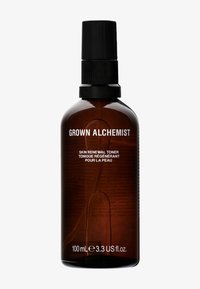 Bouteille en verre ambré avec un bouchon de pompe noir, étiquetée "GROWN ALCHEMIST" et "TONIQUE DE RÉNOVATION DE LA PEAU," contenant 100 mL de liquide.