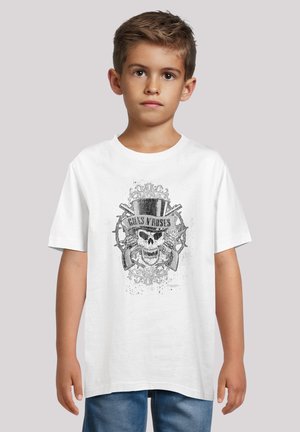 White cotton t-shirt featuring a graphic print with a skull, top hat, and crossed guns, in black and gray tones, on a plain background.