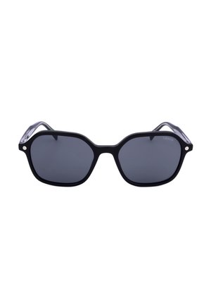 Occhiali da sole esagonali neri oversize con lenti scure e sottili accenti silver agli angoli della montatura.