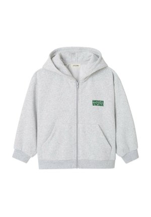 Felpa con cappuccio con zip di colore grigio chiaro, con tasche frontali e testo verde "American Vintage" sul petto sinistro.