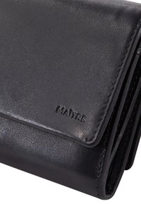 Black leather wallet with a smooth texture, featuring a fold-over design and embossed logo detail. Compact and sleek.