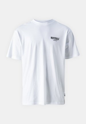 White cotton t-shirt with short sleeves, a crew neck, featuring black text that reads "MONTREAL" on the left chest area.