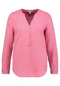 Camicia rosa a maniche lunghe in lino leggero, con scollatura a V, pattina con bottoni e dettagli sui polsini con orlo arrotondato.