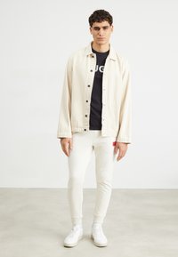 HUGO DOAK - Tracksuit bottoms - open white