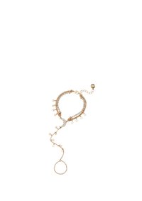 Bracelet chaîne en or avec pendentif lune et accents étoiles, orné de cristaux ; fermoir ajustable à la chaînette.