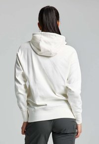 Felpa off-white con cappuccio e cordino, maniche lunghe e polsini a coste. Realizzata in materiale morbido, con una vestibilità comoda e design semplice.