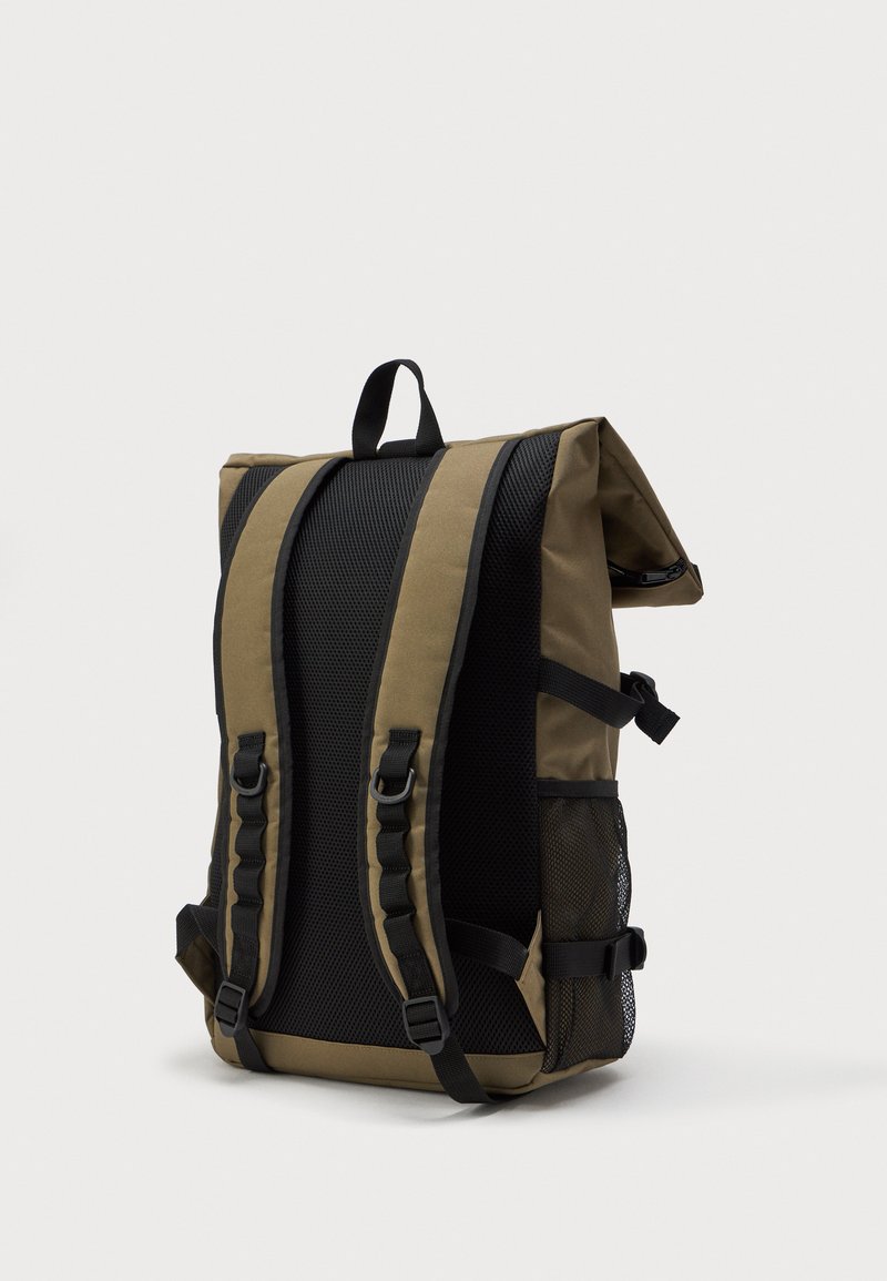 Khaki and black backpack angled with padded straps, breathable back panel, side mesh pocket, and top handle on plain background.