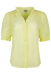 Blusa gialla realizzata in tessuto leggero, caratterizzata da un motivo a pois texturizzato, scollatura arricciata e maniche a sbuffo con polsini elastici.