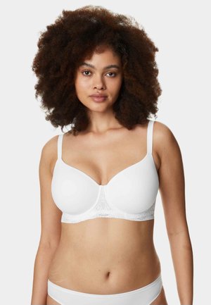 White bra with smooth cups, adjustable straps, and delicate lace trim along the bottom. Features rounded shape and seamless design.