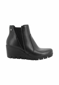 Stivale alla caviglia in pelle nera con tacco a chiocciola, pannelli laterali elasticizzati e suola testurizzata. Design elegante con minimi dettagli in metallo.