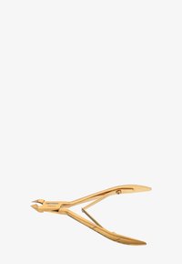 Obcinacz do skórek ze stali nierdzewnej w złotym odcieniu, z zawiasem sprężynowym i ostrymi, skośnymi ostrzami, oznaczony napisem "Tweezerman Stainless".