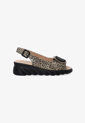 Leopard print slingback sandal with a rounded toe, black accent, and a textured platform sole, featuring a buckle strap for secure fit.